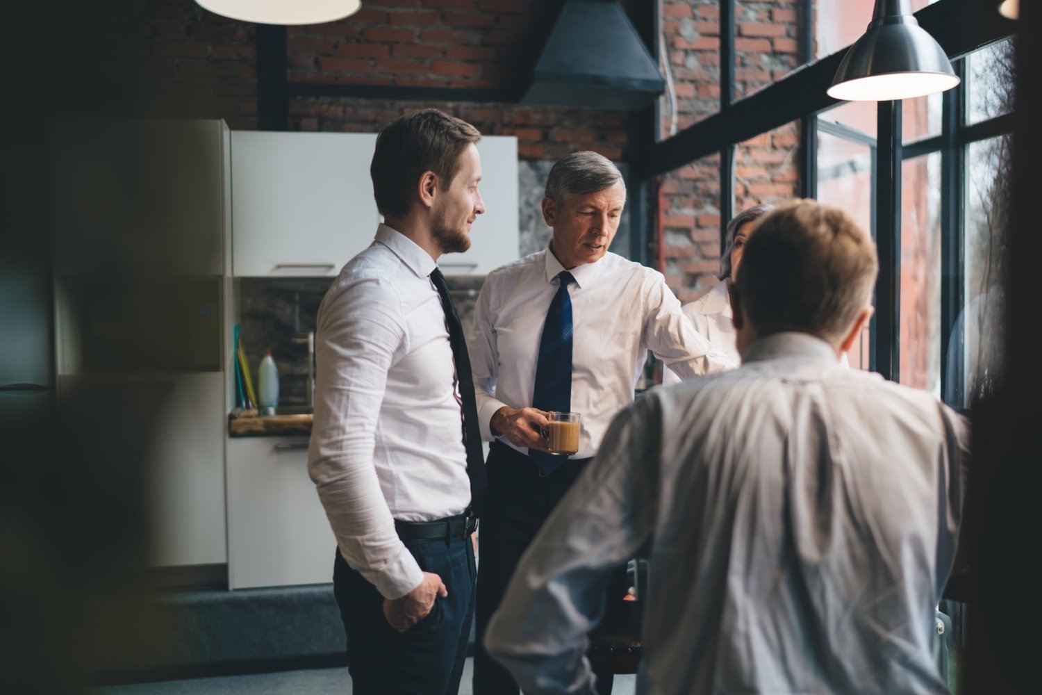 business partners having conversation in office hr3g8r3.jpg